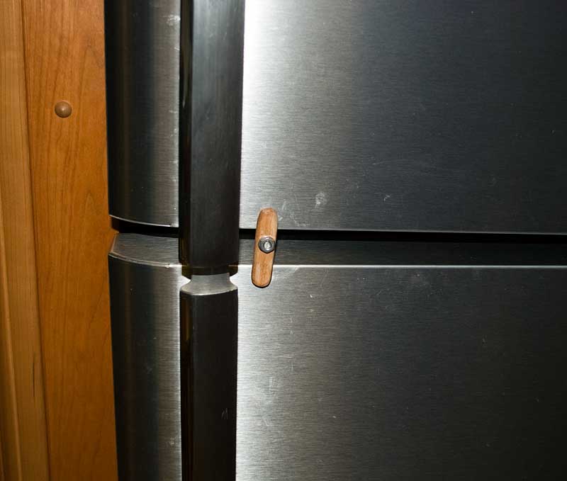Latch or dog to keep the doors closed